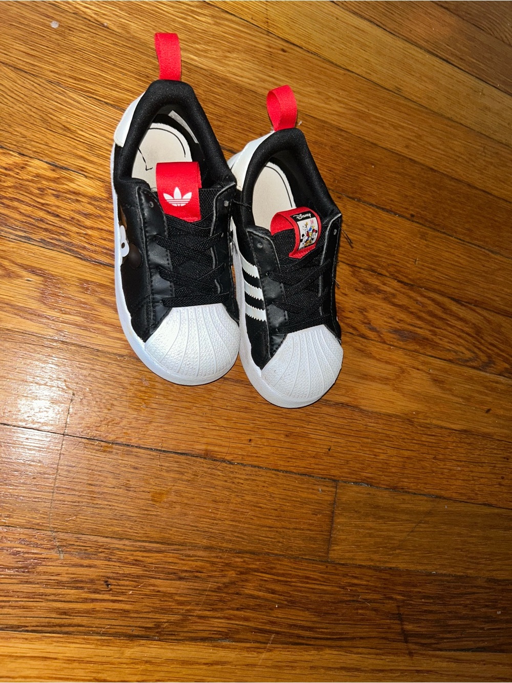 adidas Kids Black & White Slip-On Sneakers with Red Pull Tabs